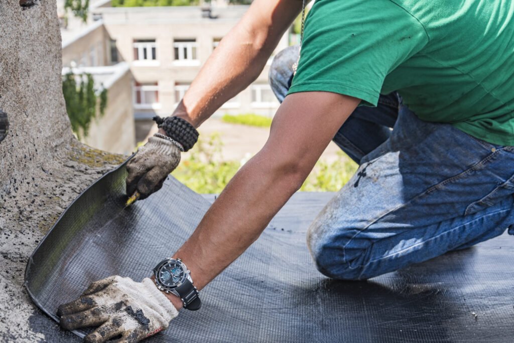 worker performs overhaul roof residential building scaled.jpg